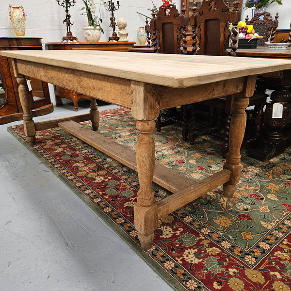 Raw refectory French Oak dining table of pleasing narrow proportions. It has been sourced from France and is in good original condition.