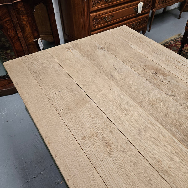 Raw refectory French Oak dining table of pleasing narrow proportions. It has been sourced from France and is in good original condition.