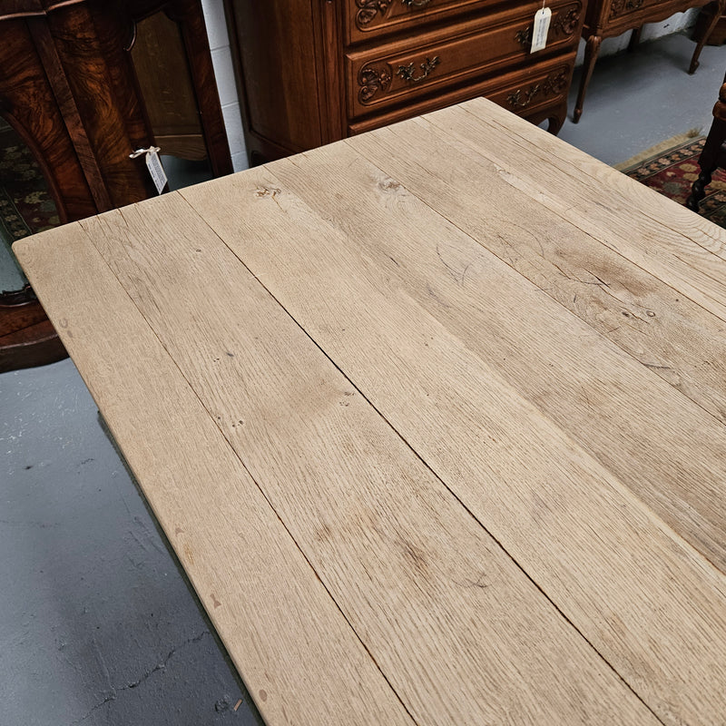 Raw refectory French Oak dining table of pleasing narrow proportions. It has been sourced from France and is in good original condition.