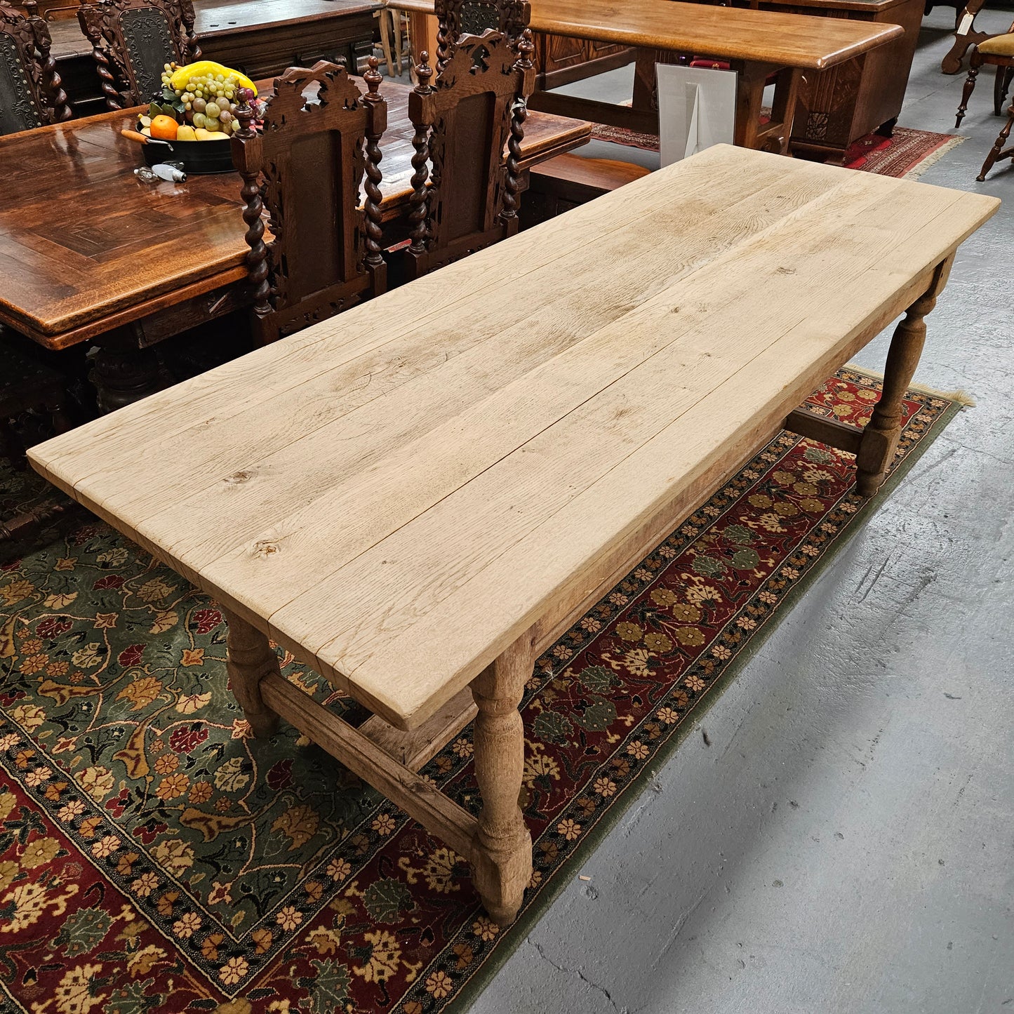Raw refectory French Oak dining table of pleasing narrow proportions. It has been sourced from France and is in good original condition.