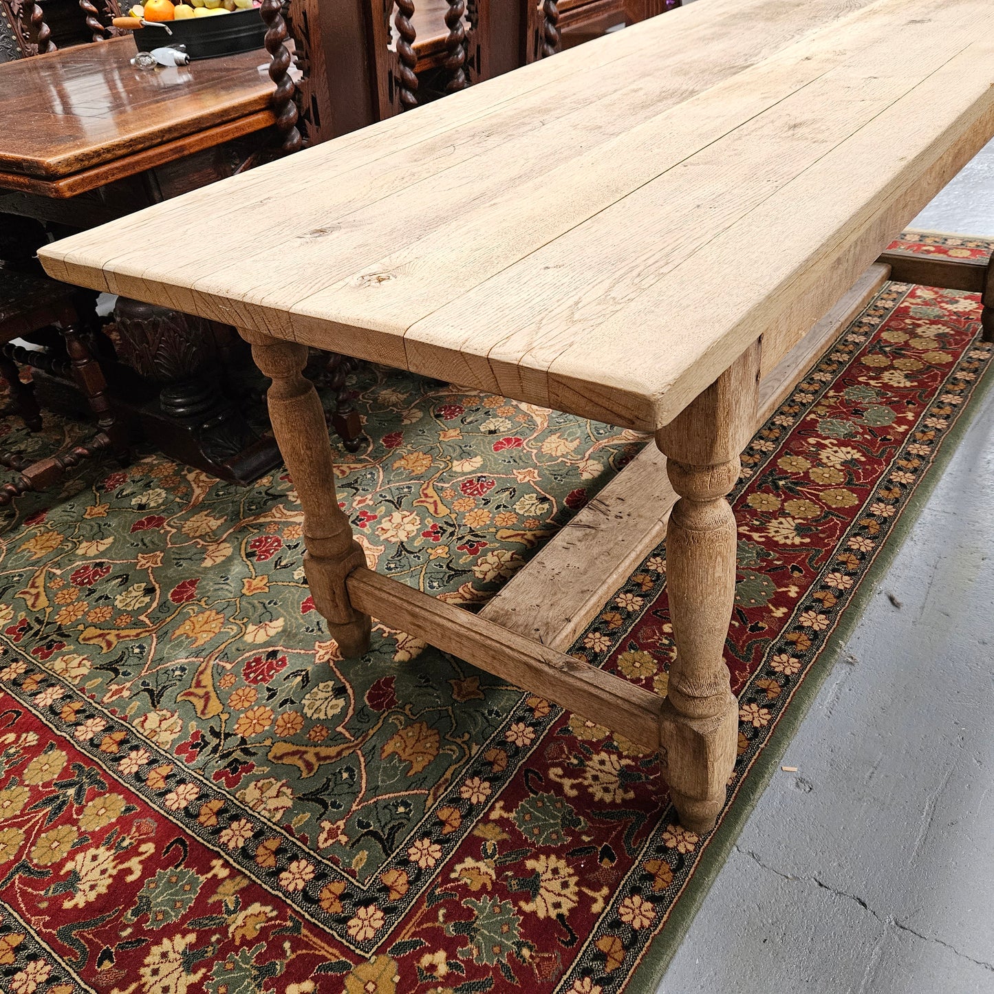 Raw refectory French Oak dining table of pleasing narrow proportions. It has been sourced from France and is in good original condition.