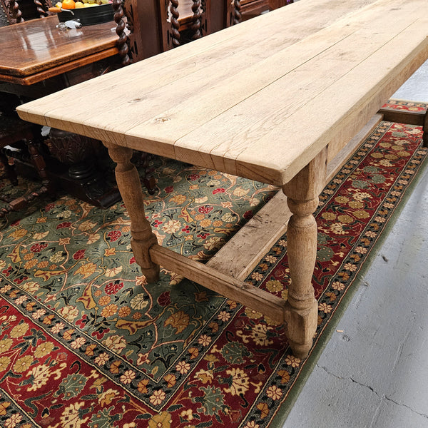 Raw refectory French Oak dining table of pleasing narrow proportions. It has been sourced from France and is in good original condition.
