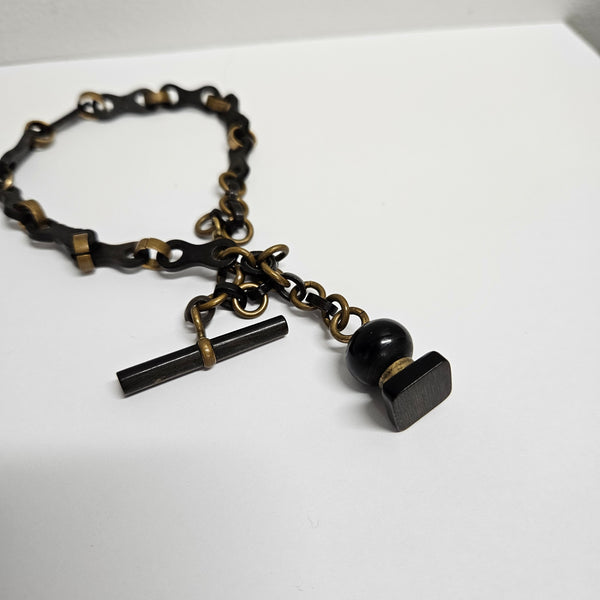 Unusual Antique Whitby Jet & Brass Mourning Fob Watch Chain. with interesting Whitby Jet Fob. In good original condition. Please see all photos as they form part of the description.