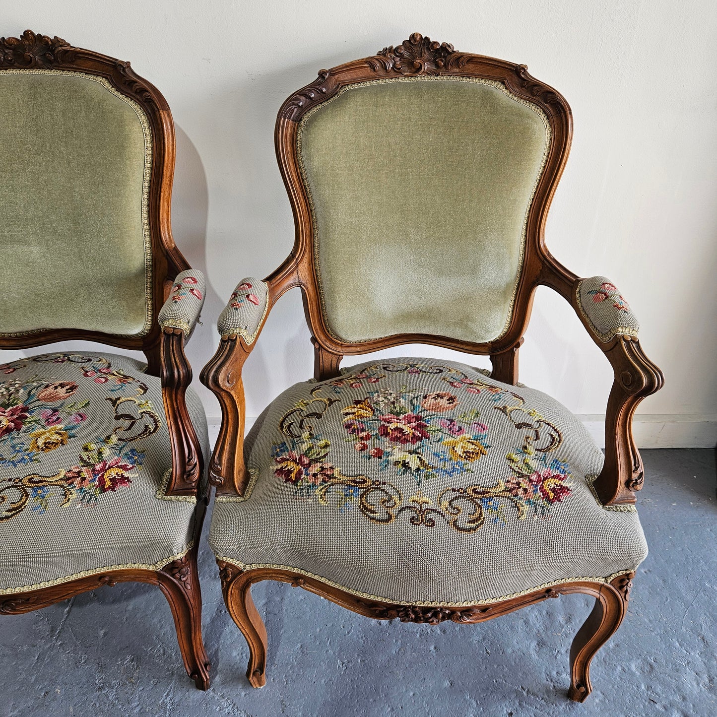 Beautiful pair of Louis XV carved walnut tapestry upholstered armchairs. Circa 1930's. In good condition. Please see photos as they form part of the description.