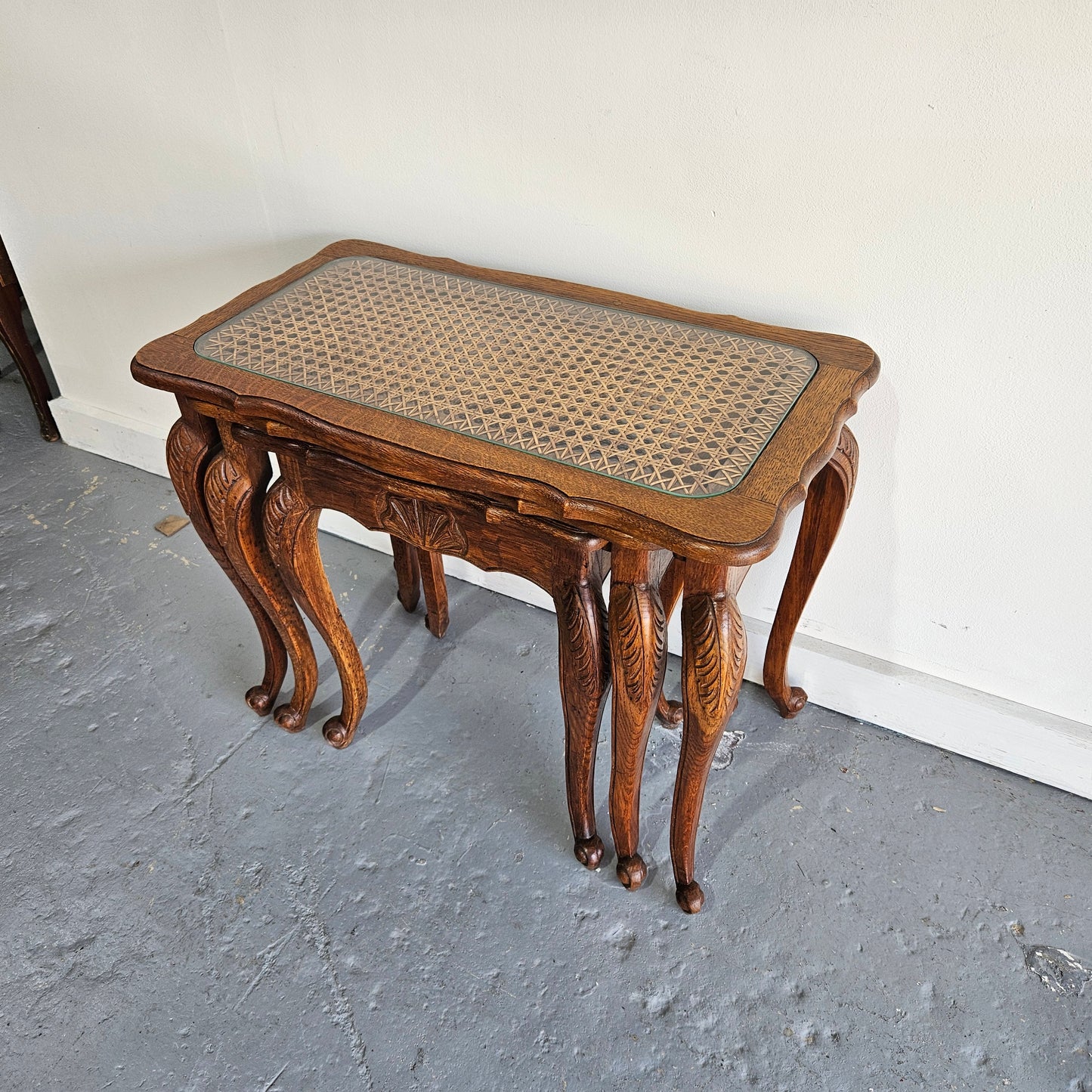 Stunning set of 3 nested table with cane inset and glass top, in great original detailed condition. Please see photos as they form part of the description   