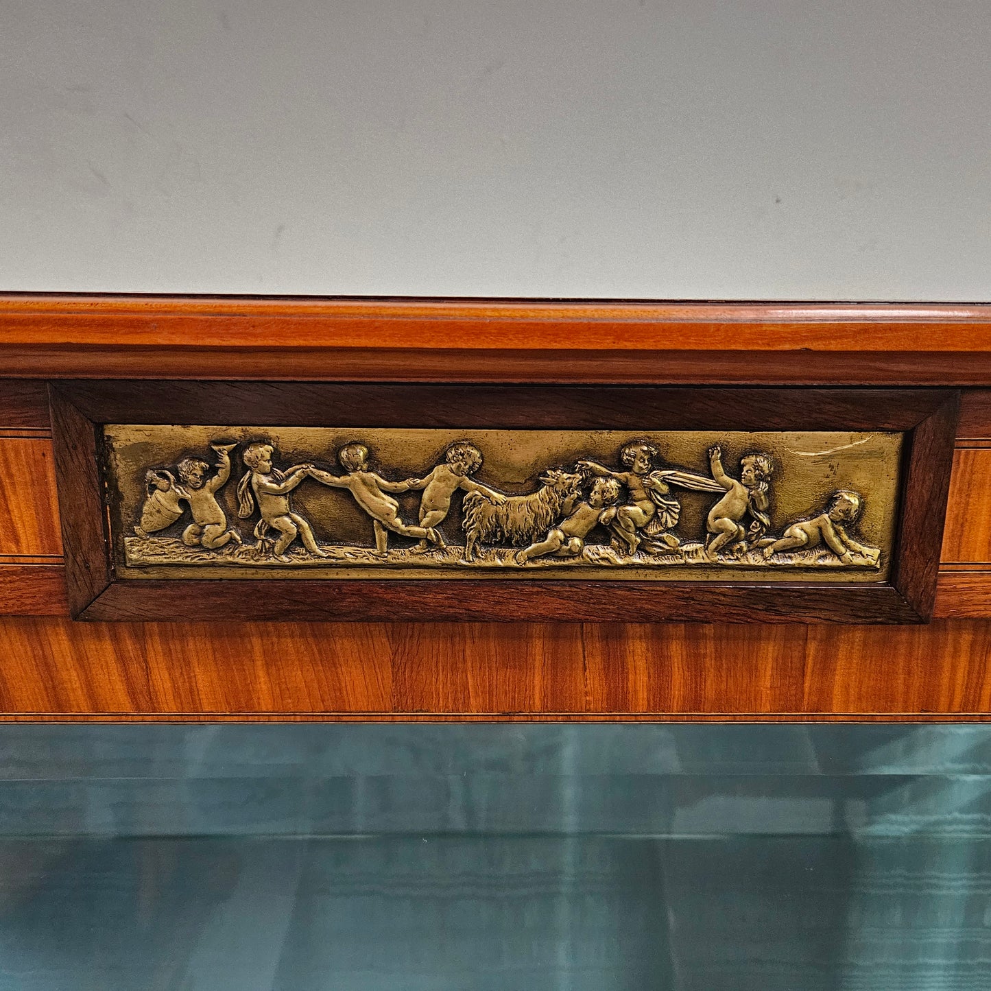 Elegant three door Louis XV transitional style vitrine with decorative bronze mounts. This unit has two glass shelves and one wooden shelf providing plenty of storage. It is in great original detailed condition. Please see the photos as they form part of the description. 