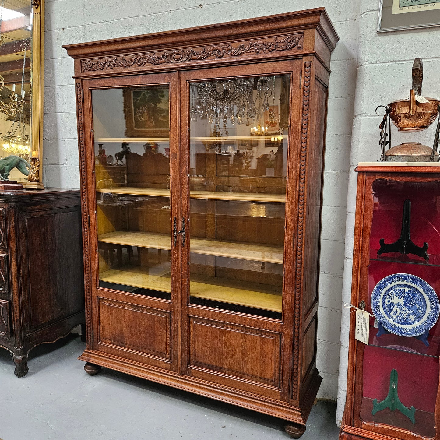 Amazing Louis XVI style two door bookcase with five shelves and beautiful carvings. It is in great original condition. Please see photos as they form part of the description