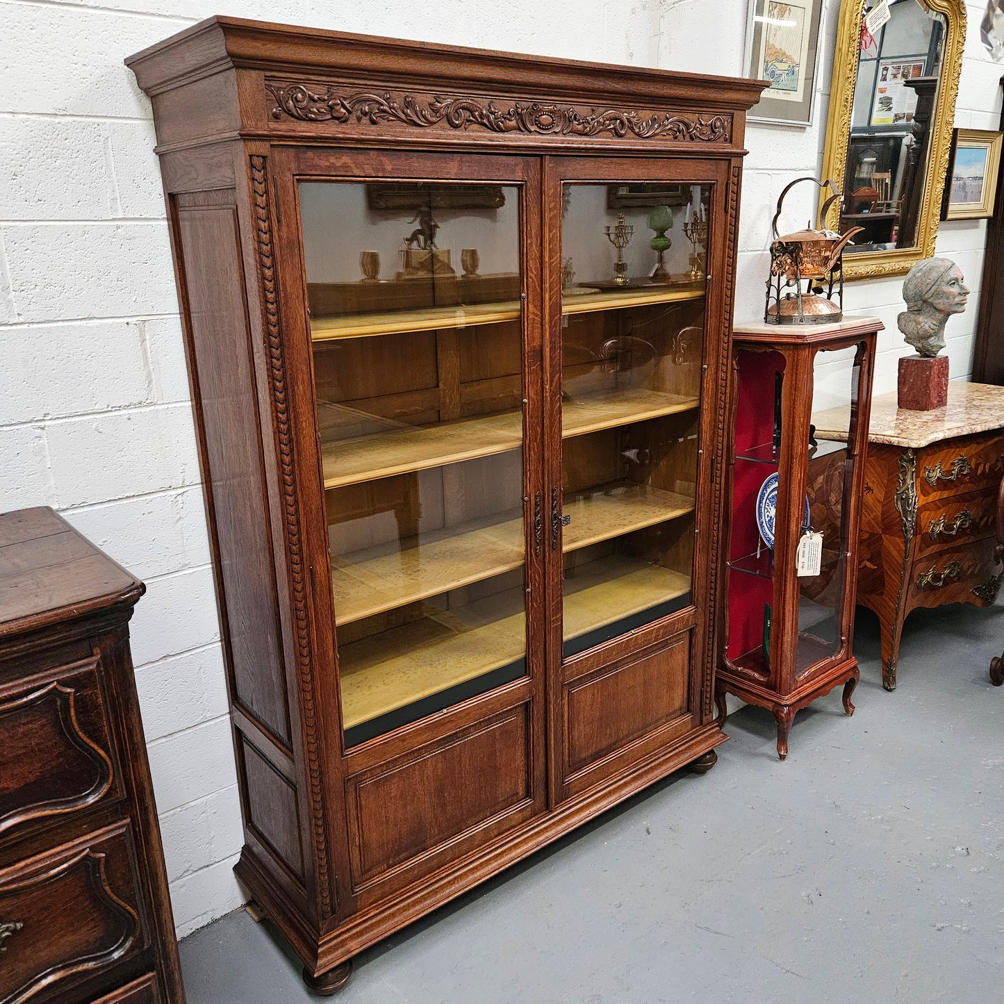 Amazing Louis XVI style two door bookcase with five shelves and beautiful carvings. It is in great original condition. Please see photos as they form part of the description