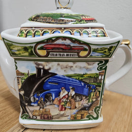 Vintage James Sadler Teapot "Golden Age of Travel" Steam Train Journeys, in good original condition. Please view photos as they form part of the description.