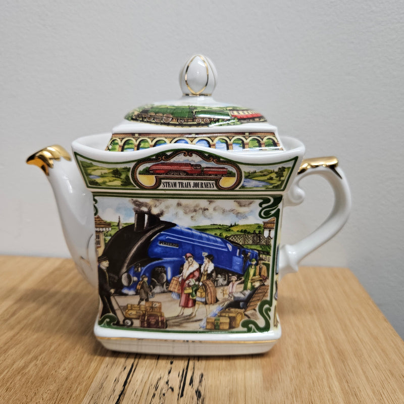 Vintage James Sadler Teapot "Golden Age of Travel" Steam Train Journeys, in good original condition. Please view photos as they form part of the description.