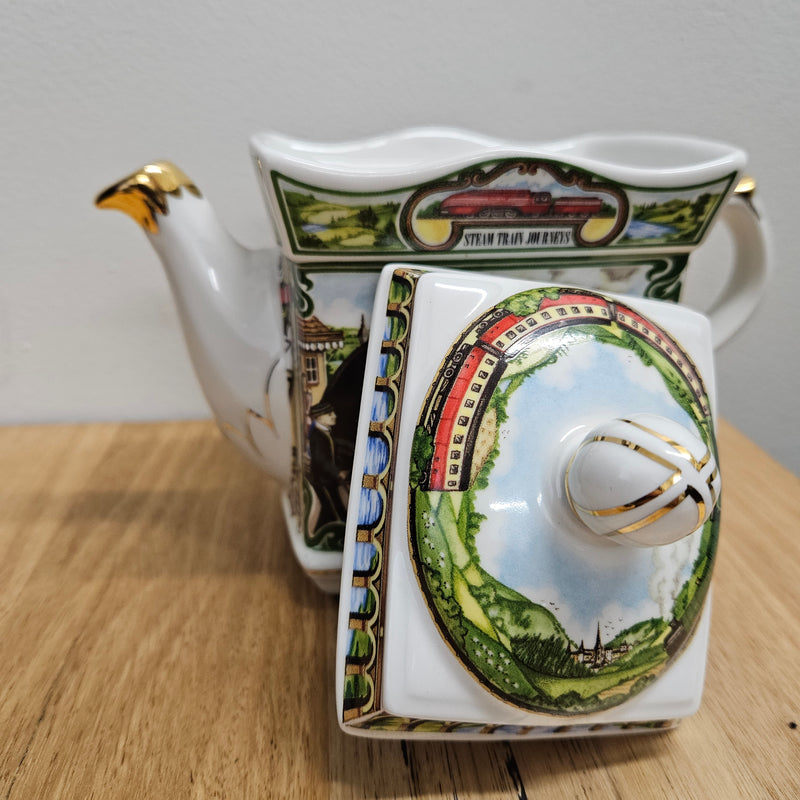 Vintage James Sadler Teapot "Golden Age of Travel" Steam Train Journeys, in good original condition. Please view photos as they form part of the description.