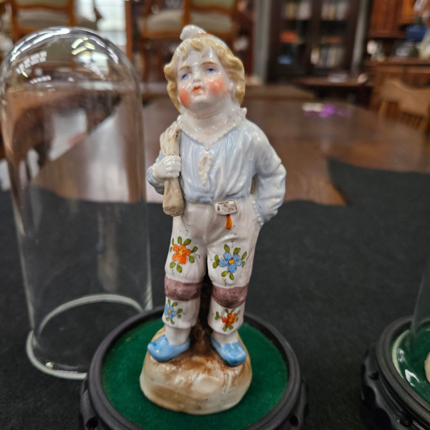 Pair Late Victorian Austrian figures displayed in glass domes