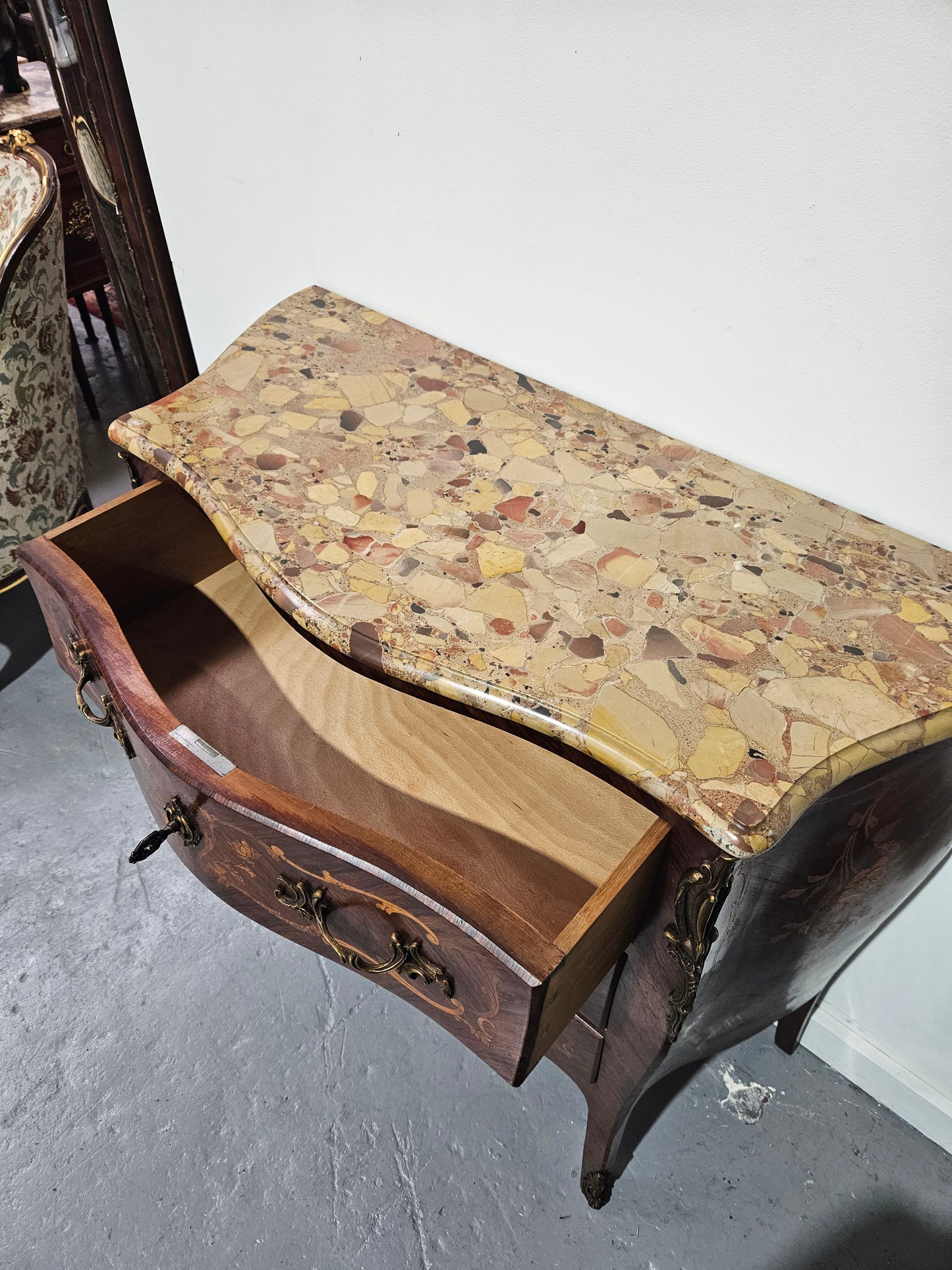 Stunning Antique rosewood three drawer marquetry inlaid marble top commode with ormolu mounts. It is in great original detailed condition. Please see photos as they form part of the description.