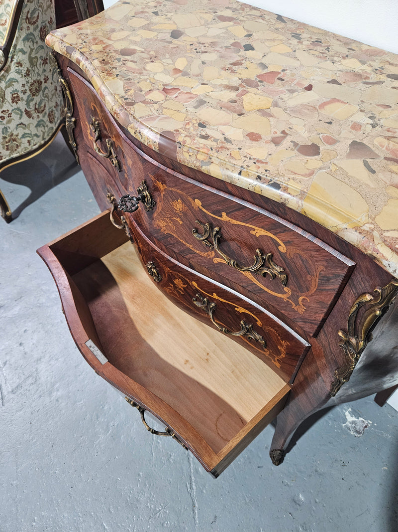 Stunning Antique rosewood three drawer marquetry inlaid marble top commode with ormolu mounts. It is in great original detailed condition. Please see photos as they form part of the description.
