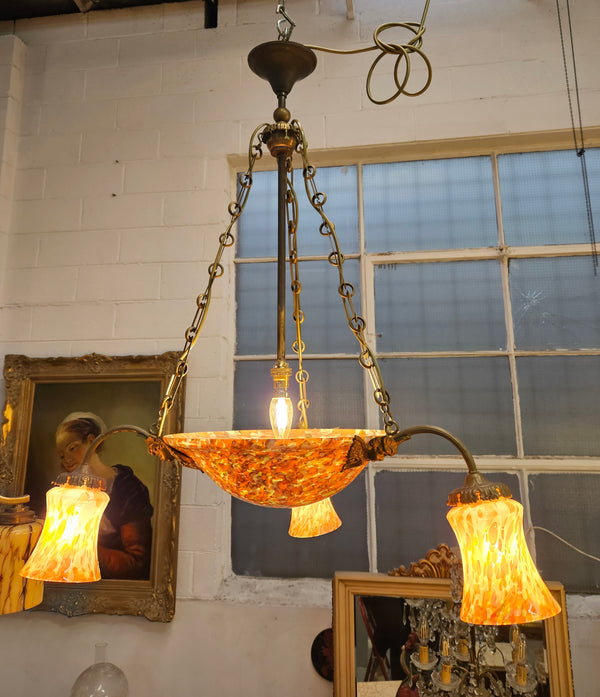 Amazing four light French Art Deco molten glass and brass chandelier with its original shades and bowls. This chandelier has been rewired to Australian standards. It is in good original condition. Please see photos as they form part of the descri