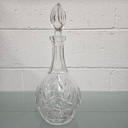 Beautifully shaped cut crystal Decanter and Stopper.  Please see photos as they form part of the description.