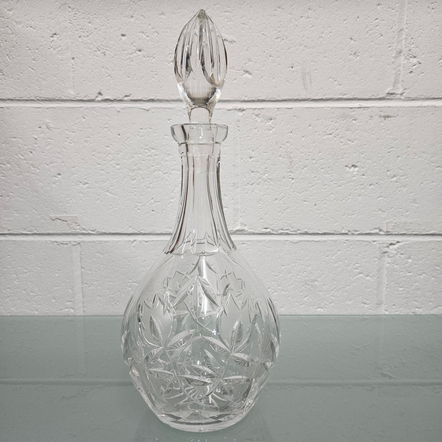 Beautifully shaped cut crystal Decanter and Stopper.  Please see photos as they form part of the description.