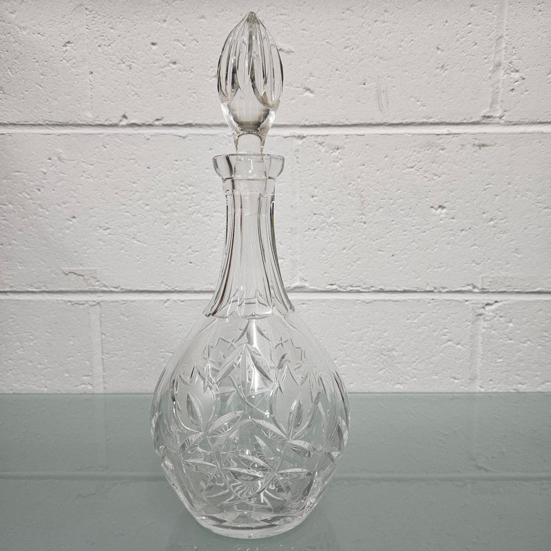 Beautifully shaped cut crystal Decanter and Stopper.  Please see photos as they form part of the description.