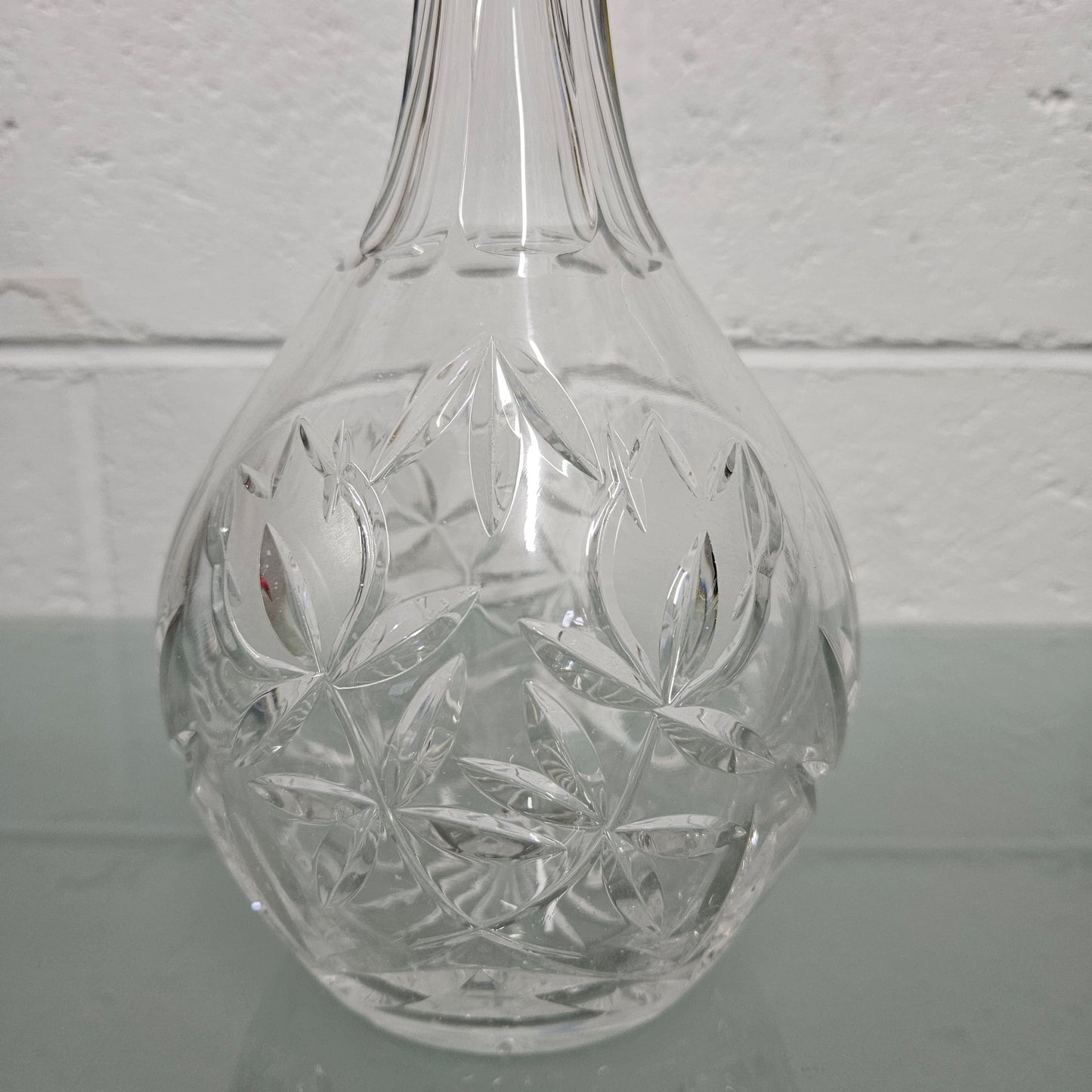 Beautifully shaped cut crystal Decanter and Stopper.  Please see photos as they form part of the description.