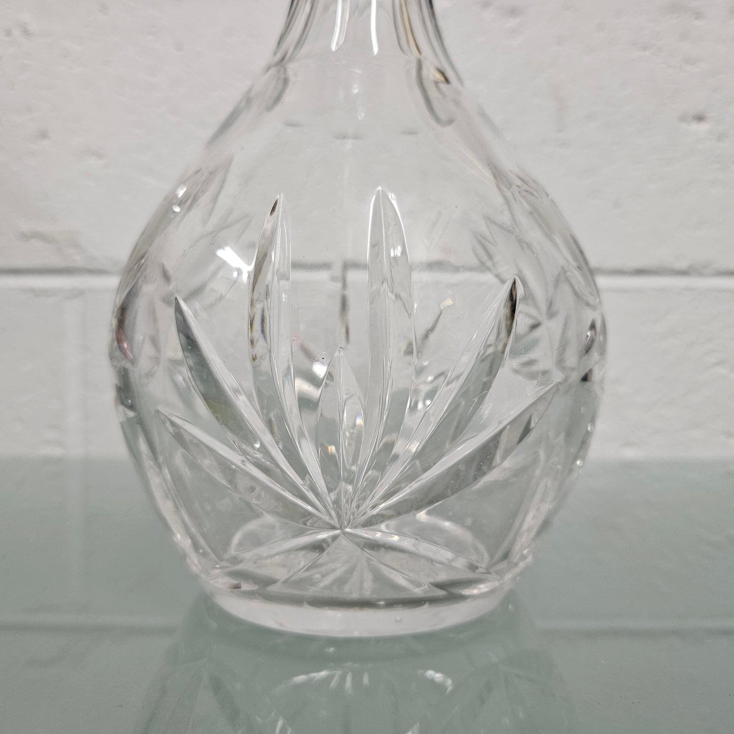 Beautifully shaped cut crystal Decanter and Stopper.  Please see photos as they form part of the description.