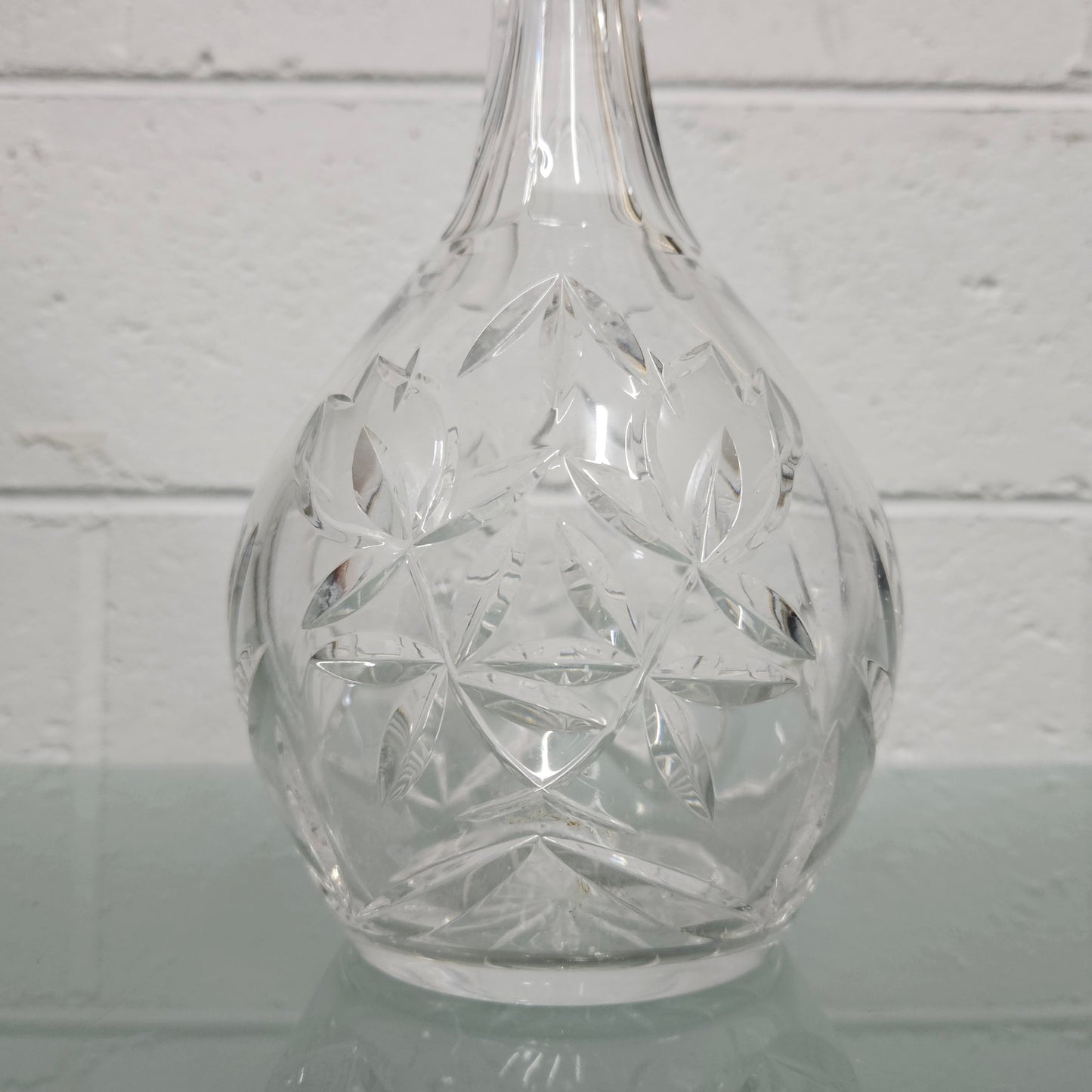 Beautifully shaped cut crystal Decanter and Stopper.  Please see photos as they form part of the description.