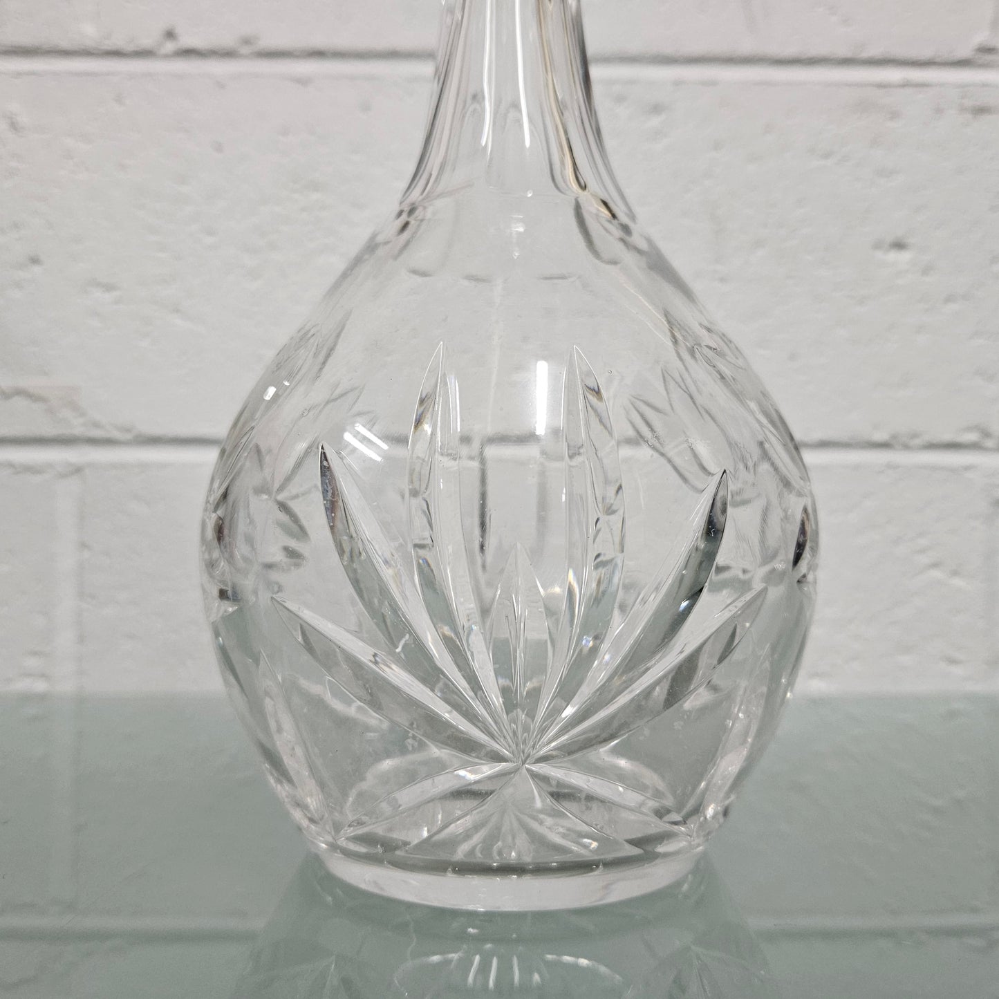 Beautifully shaped cut crystal Decanter and Stopper.  Please see photos as they form part of the description.