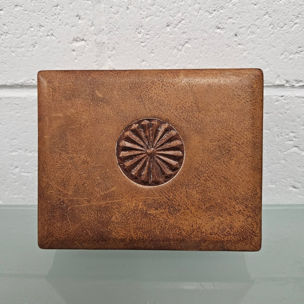 Interesting embossed leather and wood attached lid trinket box. In good original condition. Please see photos as they form part of the description.