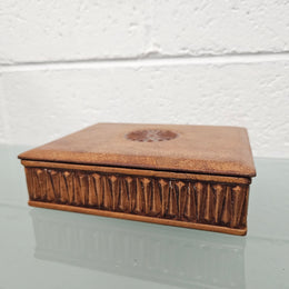 Interesting embossed leather and wood attached lid trinket box. In good original condition. Please see photos as they form part of the description.