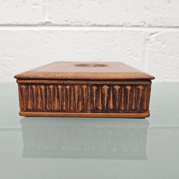 Interesting embossed leather and wood attached lid trinket box. In good original condition. Please see photos as they form part of the description.