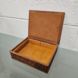 Interesting embossed leather and wood attached lid trinket box. In good original condition. Please see photos as they form part of the description.