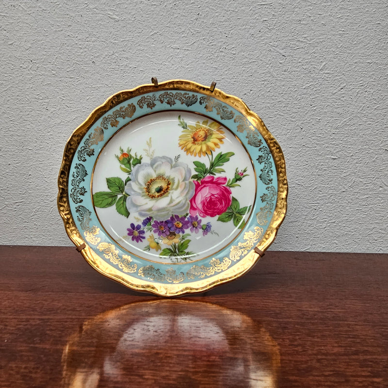 Decorative Limoges plate with stand stamped to rear and made in a France. Sourced locally and in good original condition. Please view photos as they help form part of the description.