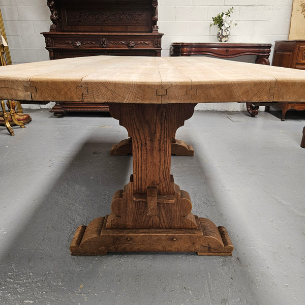 Sourced from France a raw French Oak pedestal dining table. This stunning table features raw oak timber that could be used as is for a distressed look, or finished and waxed for a more refined look. It is in good solid original condition.