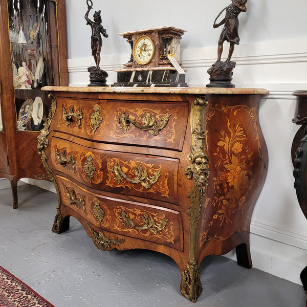 This exceptional 19th Century French Louis XV Kingwood and Rosewood marquetry inlaid marble top bombe shaped commode is an exceptional example of fine craftsmanship. Featuring exquisite decorative marquetry inlay throughout and elegant bronze mounts. It has been sourced from France and is in good original detailed condition. 