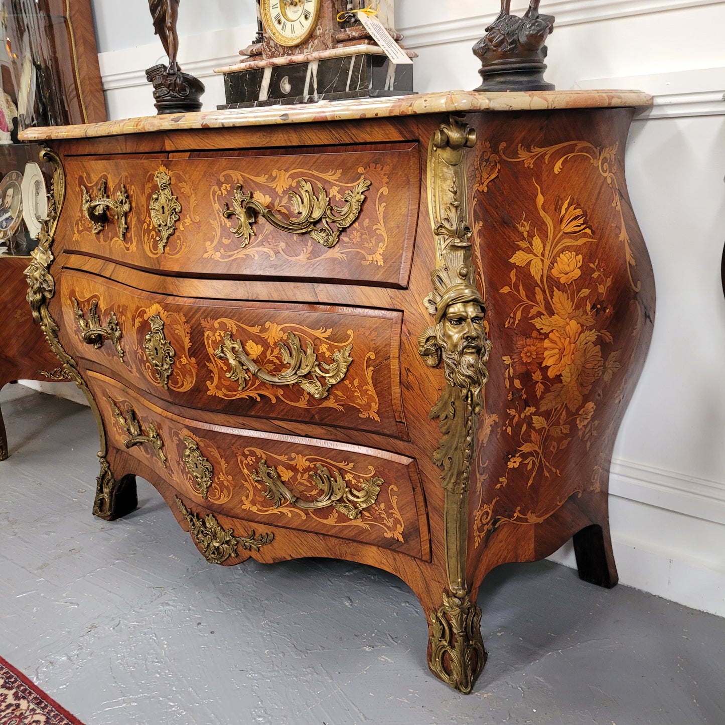 This exceptional 19th Century French Louis XV Kingwood and Rosewood marquetry inlaid marble top bombe shaped commode is an exceptional example of fine craftsmanship. Featuring exquisite decorative marquetry inlay throughout and elegant bronze mounts. It has been sourced from France and is in good original detailed condition. 