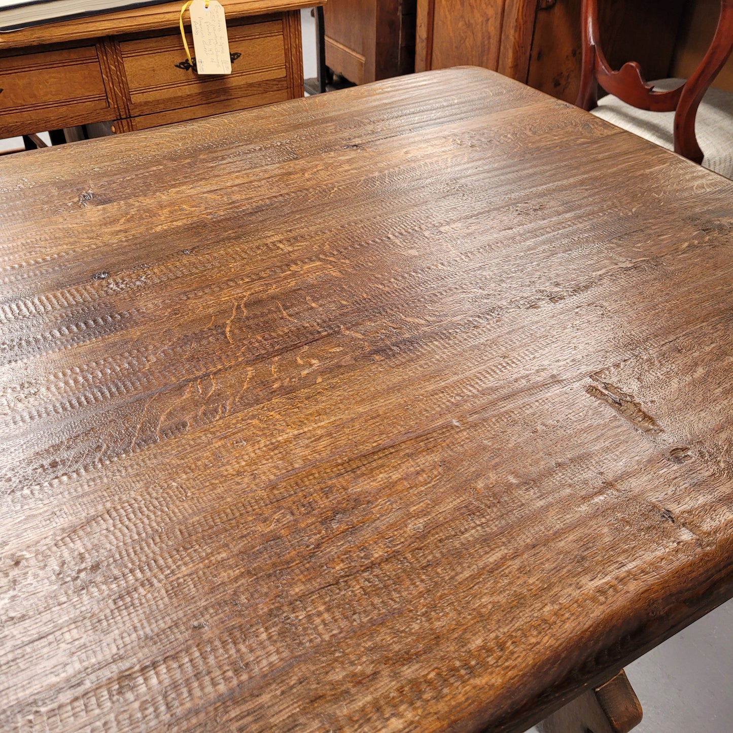 French Oak Spanish style farmhouse dining table with beautiful iron work underneath. It has been sourced from France and is in good original detailed condition.