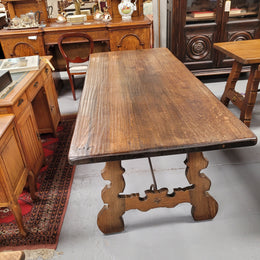 French Oak Spanish style farmhouse dining table with beautiful iron work underneath. It has been sourced from France and is in good original detailed condition.