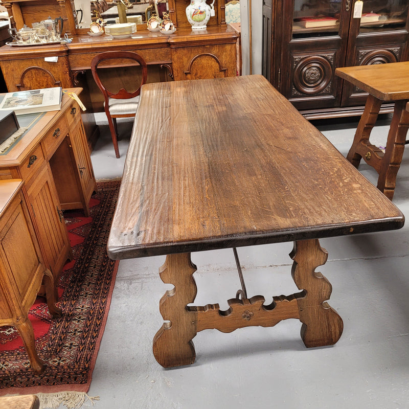 French Oak Spanish style farmhouse dining table with beautiful iron work underneath. It has been sourced from France and is in good original detailed condition.