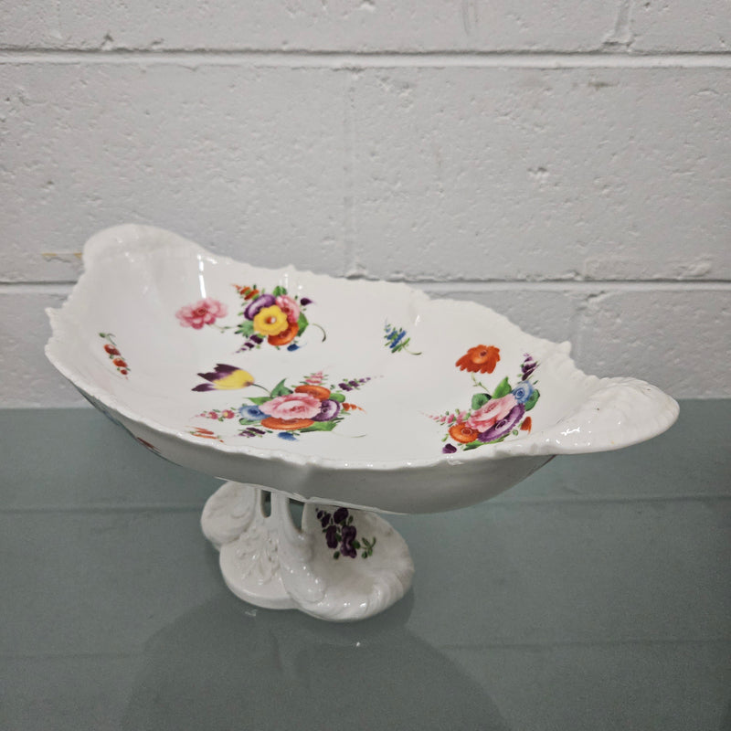 Lovely antique Coalport comport with a floral design 1830's , it is in good original condition with some faults under the bowl during the making. 