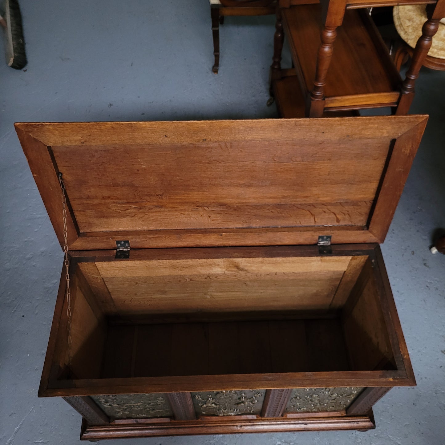 Antique French Oak coffer featuring decorative brass panels and a faux leather top. Brass panels are highly decorative featuring cherubs&nbsp; and faux leather in good used condition with very small signs of wear