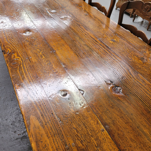 Experience the charm of our vintage reclaimed antique Spruce Pine timber farmhouse dining table, measuring 3.3 meters in length. Restored to its former glory, this table boasts sturdy construction with added central leg support for enhanced stability. This timeless piece exudes character and can comfortably accommodate up to 14 guests, making it a must-have centerpiece for your dining space.