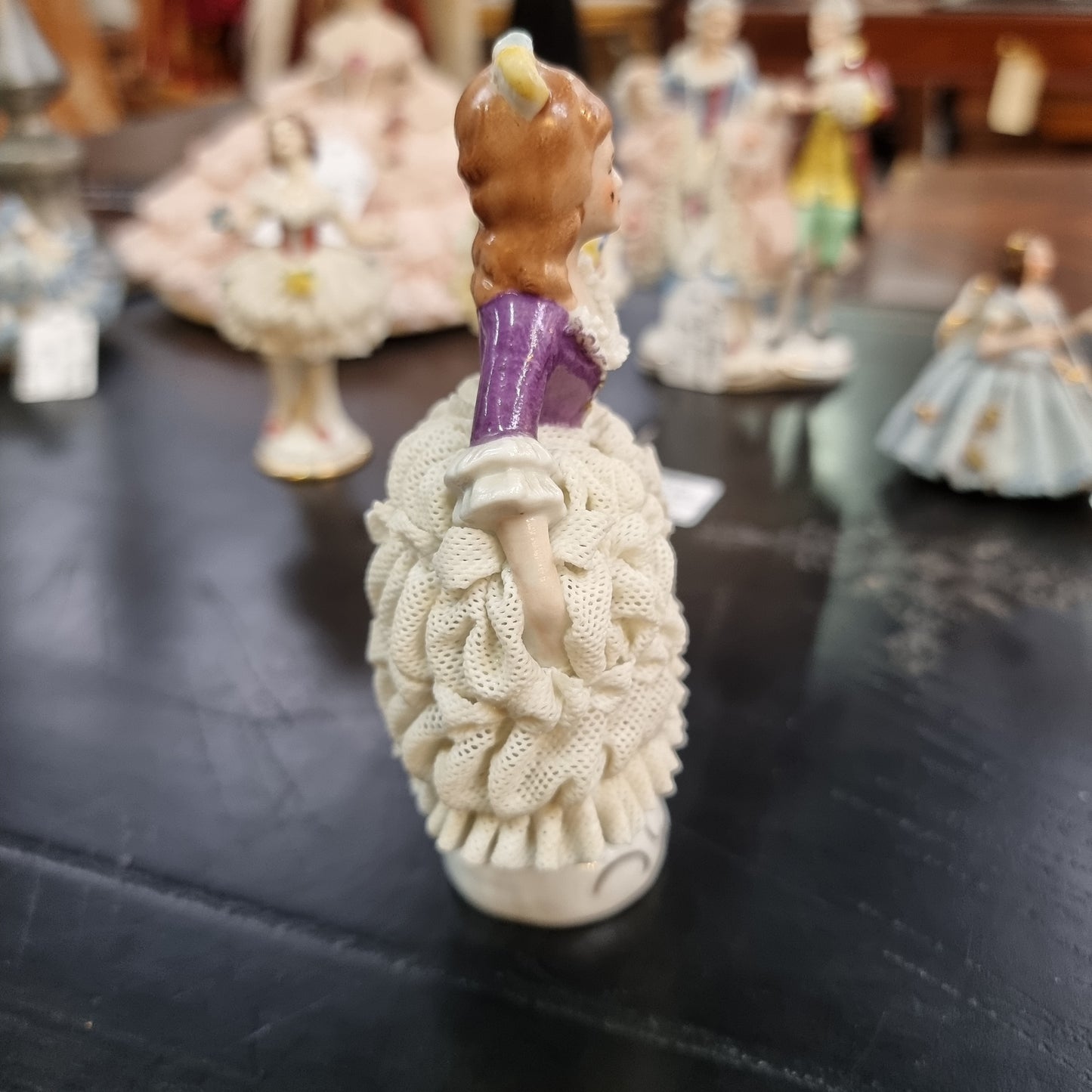 Dresden lace figurine stamped underneath and made in Germany. In good vintage condition with some slight damage to lace.