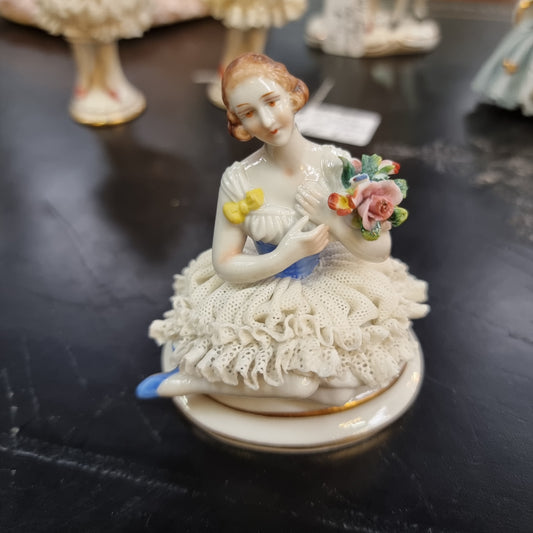 Dresden lace figurine stamped underneath and made in Germany. In good vintage condition with some slight damage to lace. 