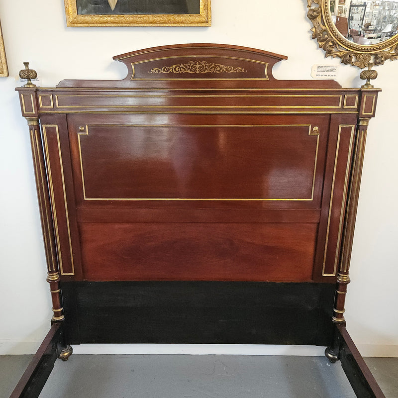 A stunning Empire French mahogany and brass inlaid queen size bed. It comes complete with side rails and custom made slats ready for your mattress. Sourced from France it is in good original detailed condition. Please view photos as they help to form part of the description and condition.