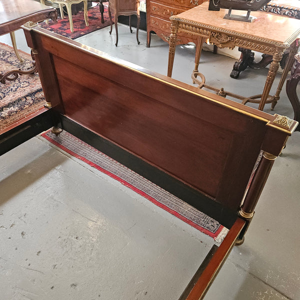 A stunning Empire French mahogany and brass inlaid queen size bed. It comes complete with side rails and custom made slats ready for your mattress. Sourced from France it is in good original detailed condition. Please view photos as they help to form part of the description and condition.