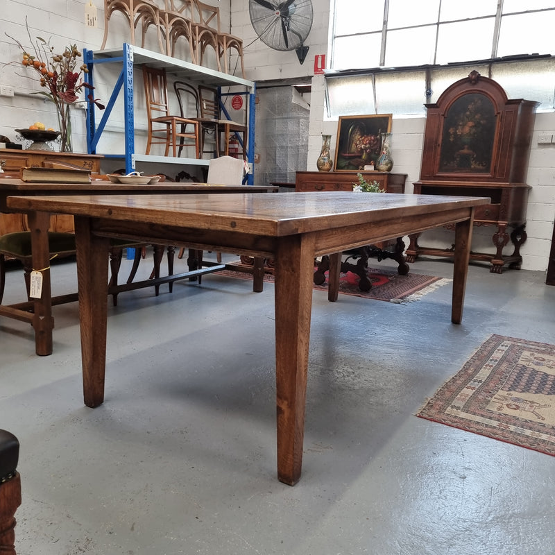 Vintage reclaimed French Oak farmhouse style dining table. It is 1 meter wide and 2.5 meters long this charming table comfortably seats 10. Made from thick Oak timber planks, It is in good original detailed condition. 