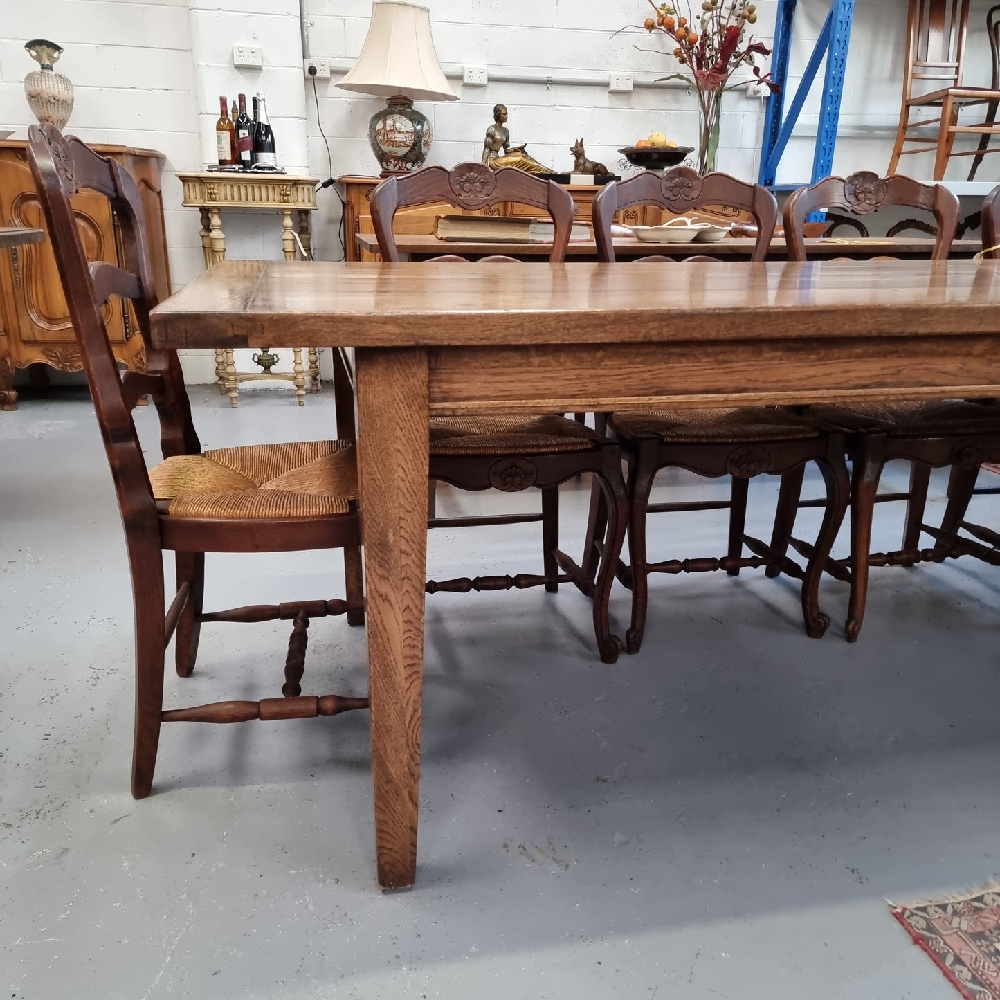 Vintage reclaimed French Oak farmhouse style dining table. It is 1 meter wide and 2.5 meters long this charming table comfortably seats 10. Made from thick Oak timber planks, It is in good original detailed condition. 