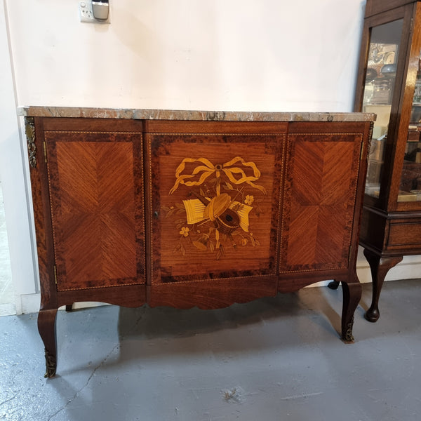 Antique late 19th century Transitional style marble top cabinet featuring beautiful marquetry inlay and decorative mounts. Made from French Walnut and Burr Walnut. In good original detailed condition. 