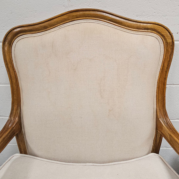 Pair of vintage Louis 15th style oak framed bergeres chairs with good size seats. making them very comfortable to sit in. The upholstery is in used condition with stains as shown in photos. Overall the timber frames are strong &amp; solid. They have been sourced directly from France. 