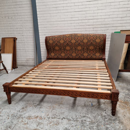 Vintage Empire style hard to find king Size bed with impressive tapestry upholstery. It comes with custom made bed slats ready to simple place your standard king size mattress on top. It is in good original detailed condition. The tapestry upholstery is in good condition and is upholstered on the back as well.