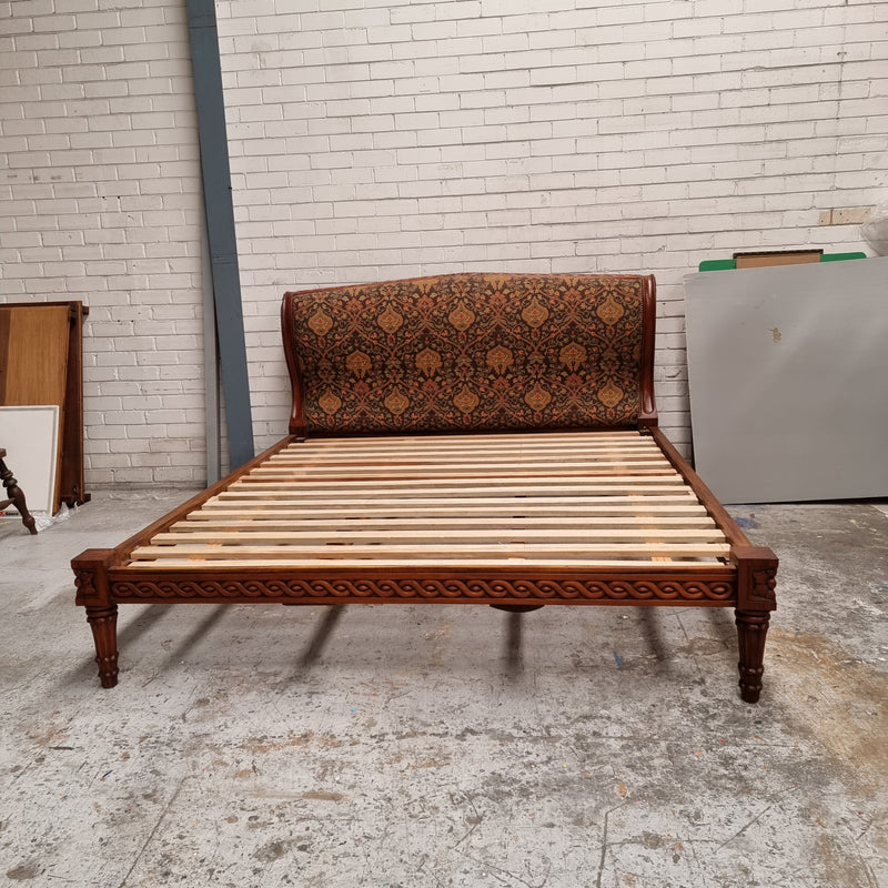 Vintage Empire style hard to find king Size bed with impressive tapestry upholstery. It comes with custom made bed slats ready to simple place your standard king size mattress on top. It is in good original detailed condition. The tapestry upholstery is in good condition and is upholstered on the back as well.